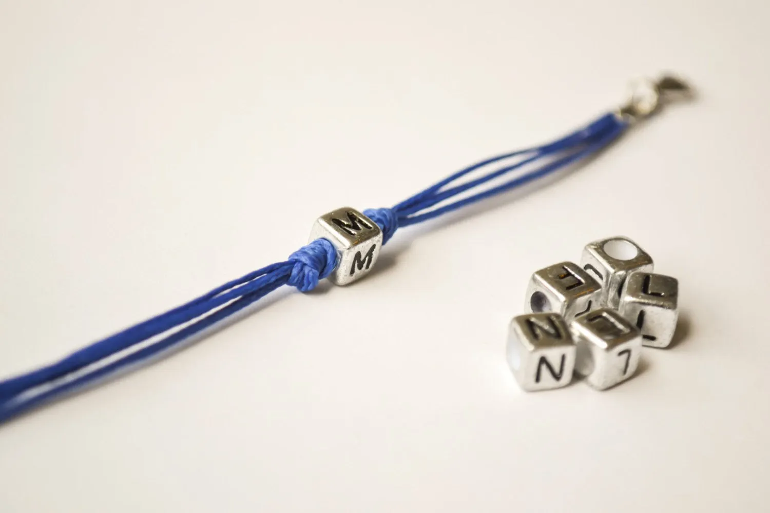 Blue cord bracelet for children with silver tone initial charm